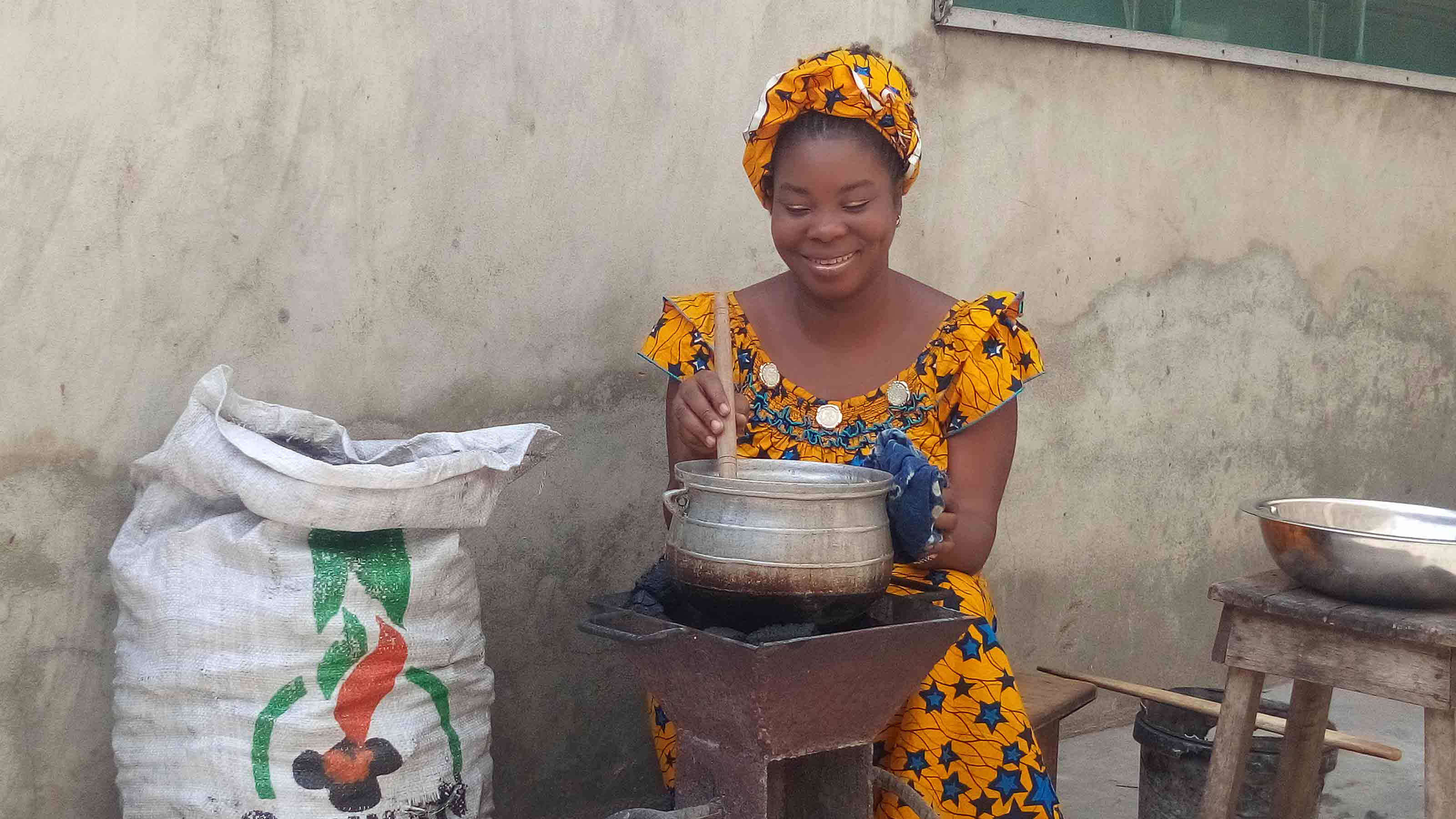 Woman cooking using Almighty Services Plus product