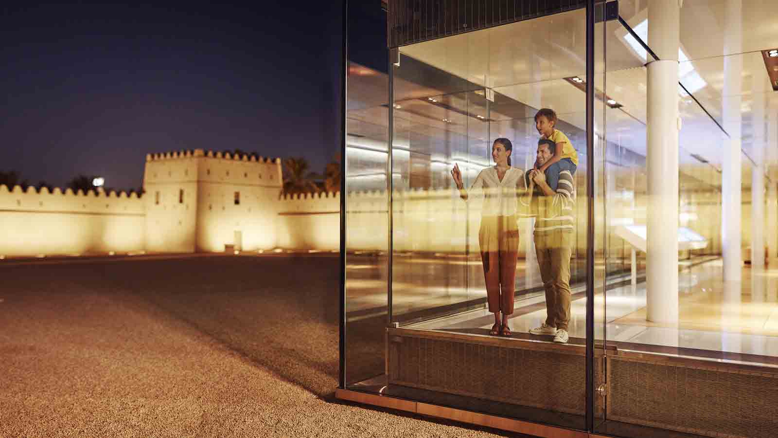 Family gazing through a glass door