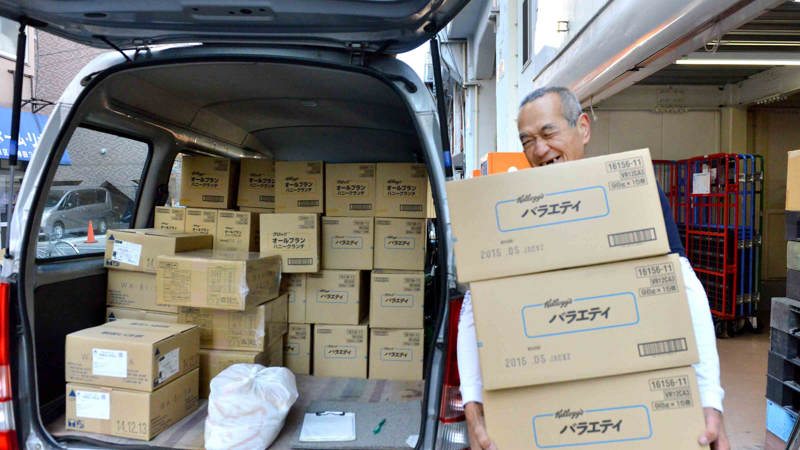 Japanese man carrying boxes