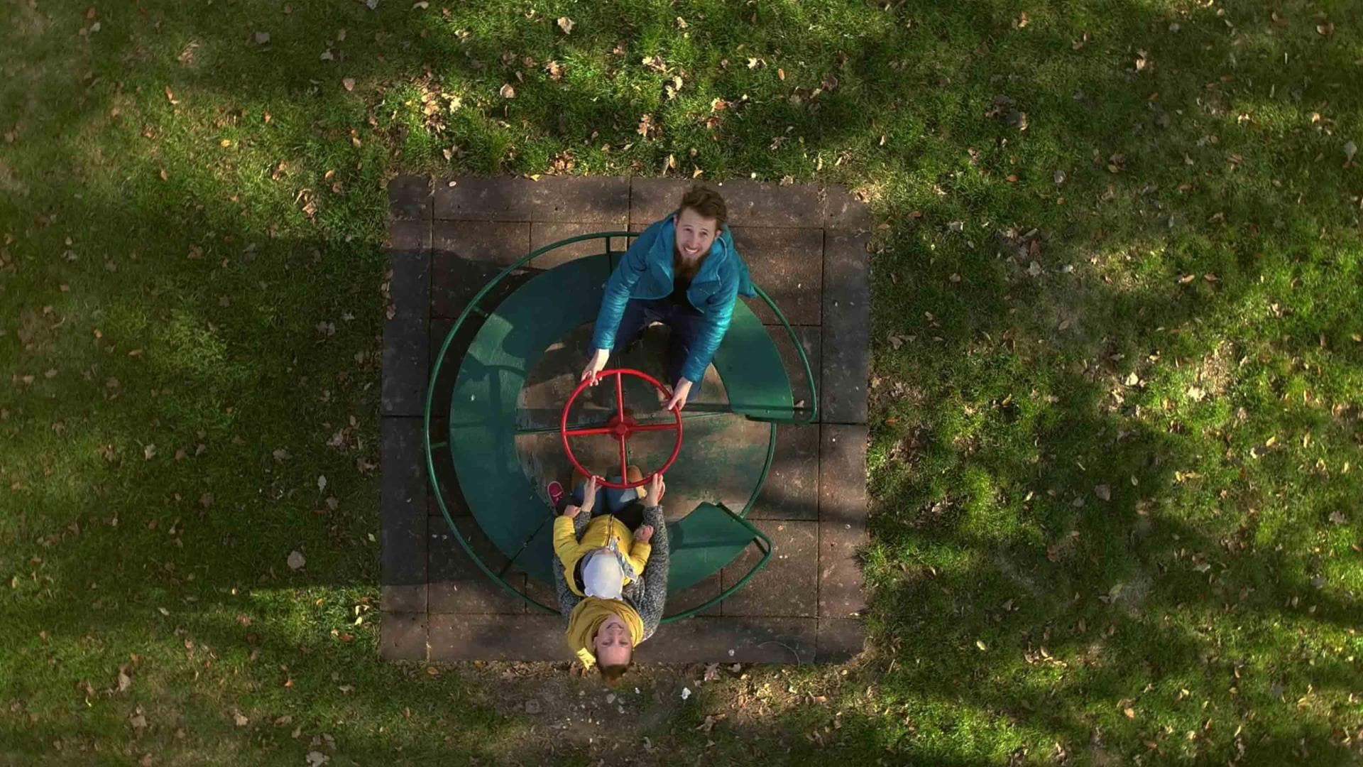 Father and child on a merry-go-round